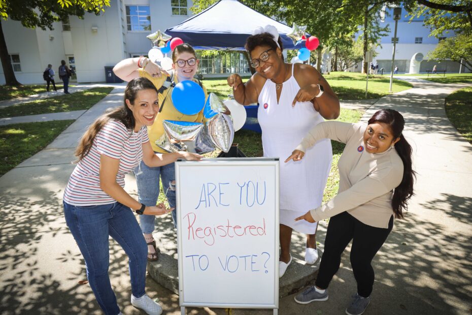 Pellissippi State students and SEAL Coordinator Delnita Evans work a voter registration table in the Hardin Valley Campus Courtyard in fall 2022