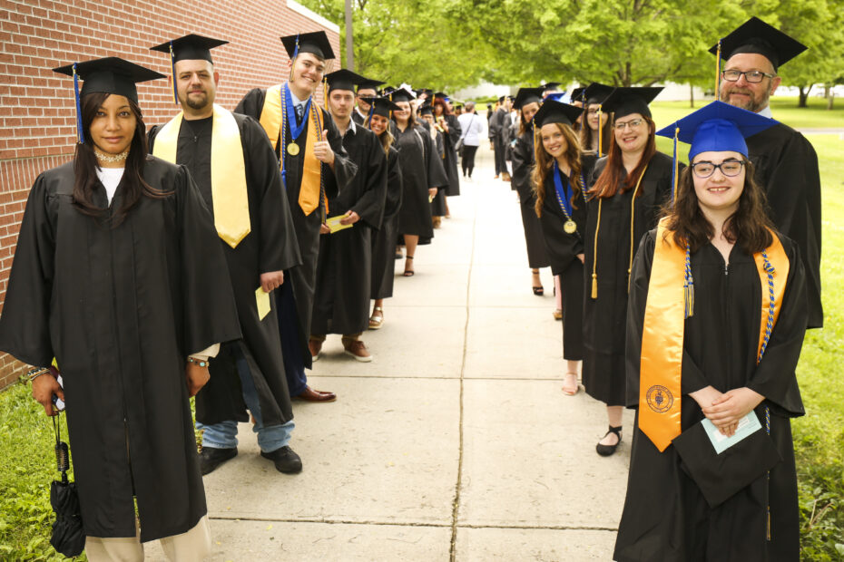 Two lines of May 2022 grads are lined up on Hardin Valley Campus and ready to walk at Commencement.