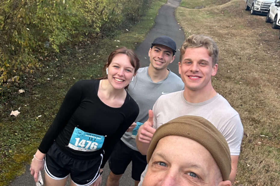 Cutline: Rebecca Duhamel, far left, gets ready to run the Secret City Half Marathon in November with family friend Sami Abu-orf, her brother, Joseph Duhamel, and her father, David Duhamel.