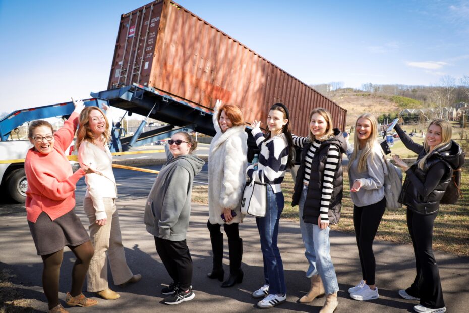 From left: Associate Professor Diane Riley, Associate Professor Julie Shubzda, Interior Design Technology student Dixie Lewis, Media and Engineering Technologies Dean Margaret Ann Jefferies and Interior Design Technology students Vanessa Lupasco, Valentyna Tretiak, Hannah West and Reagan Campbell check out the shipping container that was delivered to Pellissippi State's Hardin Valley Campus on Tuesday, Feb. 20.